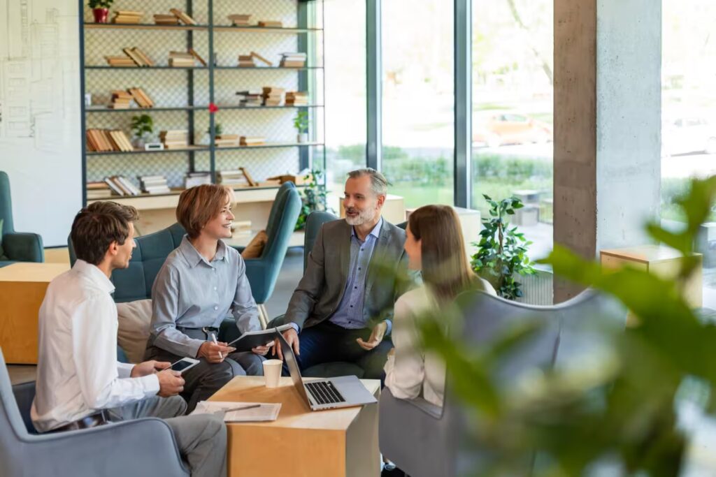 “ARCSA CAPITAL executive team discussing investment strategy and market performance during a high-level institutional meeting