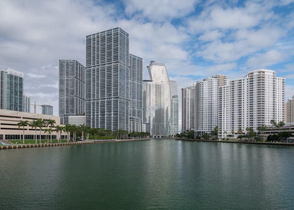 Brickell Miami skyline with modern high-rise towers along the river, illustrating the city’s institutional real estate market.