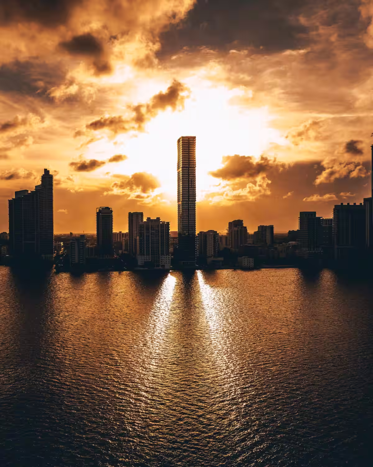 Sunrise over Miami skyline symbolizing ARCSA CAPITAL’s secure, institutional pathway to building wealth through predictable real estate returns.