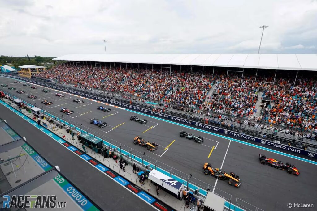 Formula 1 cars on the starting grid at Miami Grand Prix with crowd in background