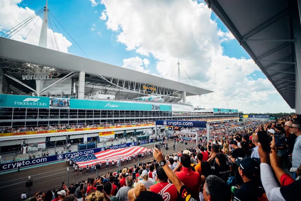 Formula 1 cars on the starting grid at Miami Grand Prix with crowd in background