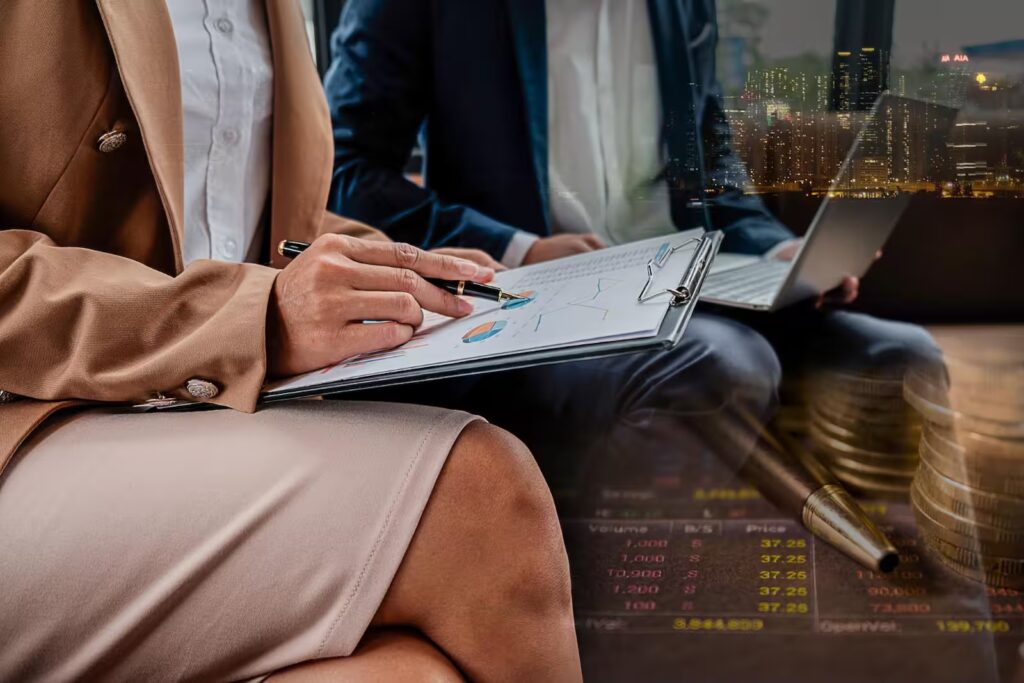 Reviewing charts and data on Miami private equity investment performance and returns.