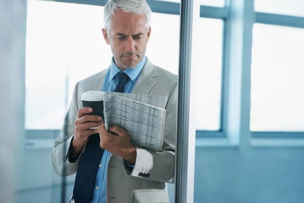 Executive reviewing long-term real estate data for future stability.